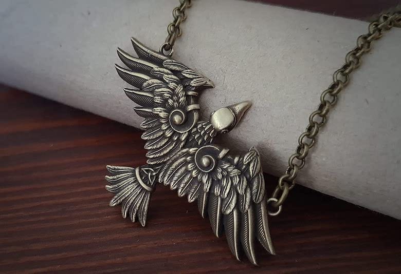 brass raven necklace